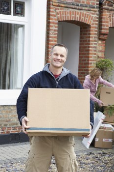 Professional flat removals planning in Richmond with packed boxes and moving van