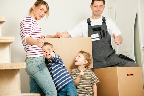 Support staff checking details during a removal van complaint investigation